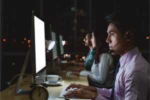 Customer service representatives working night shift.