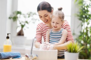 mother and daughter handwashing
